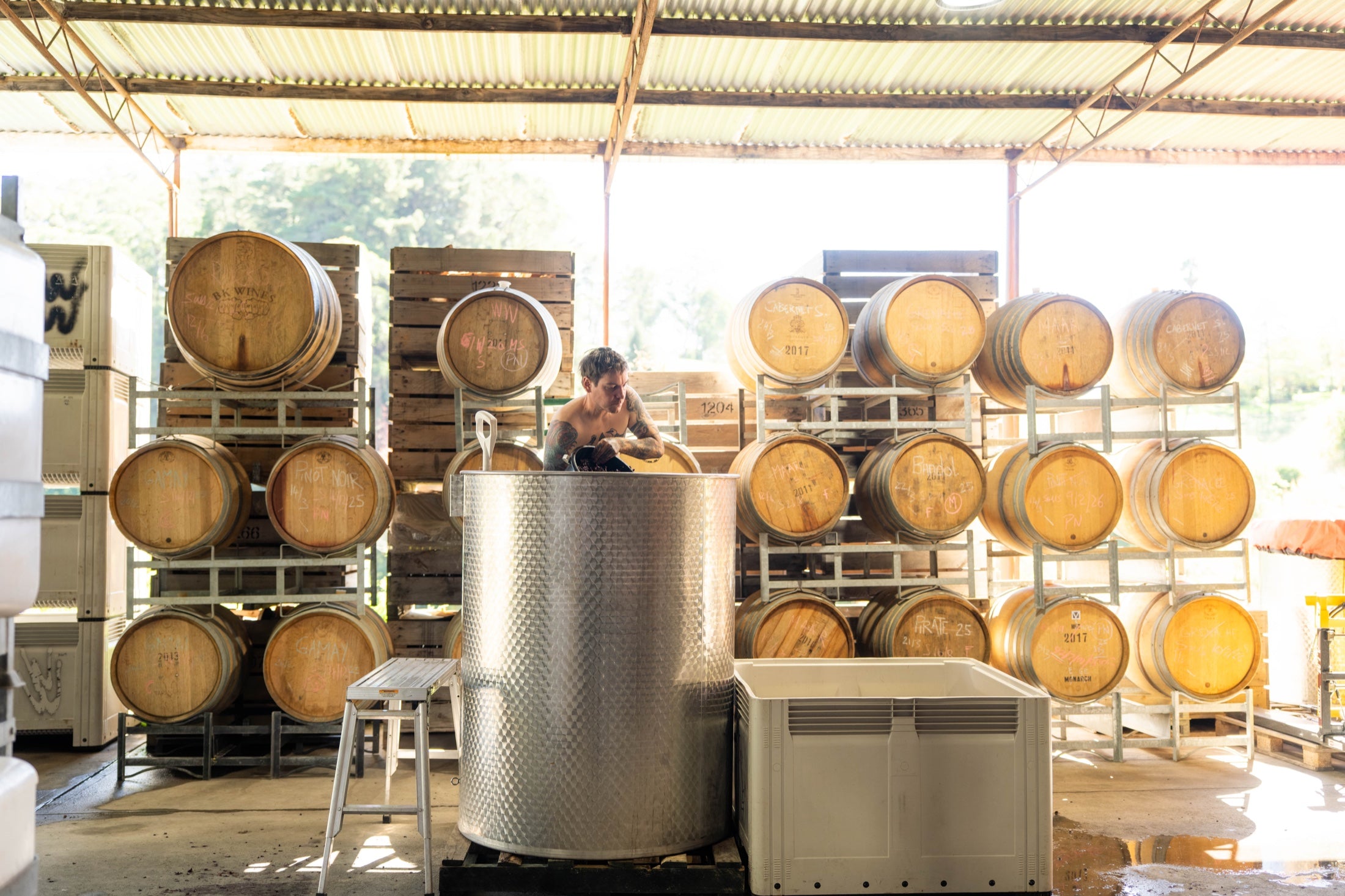 Matt Stone working with barrels in the winery